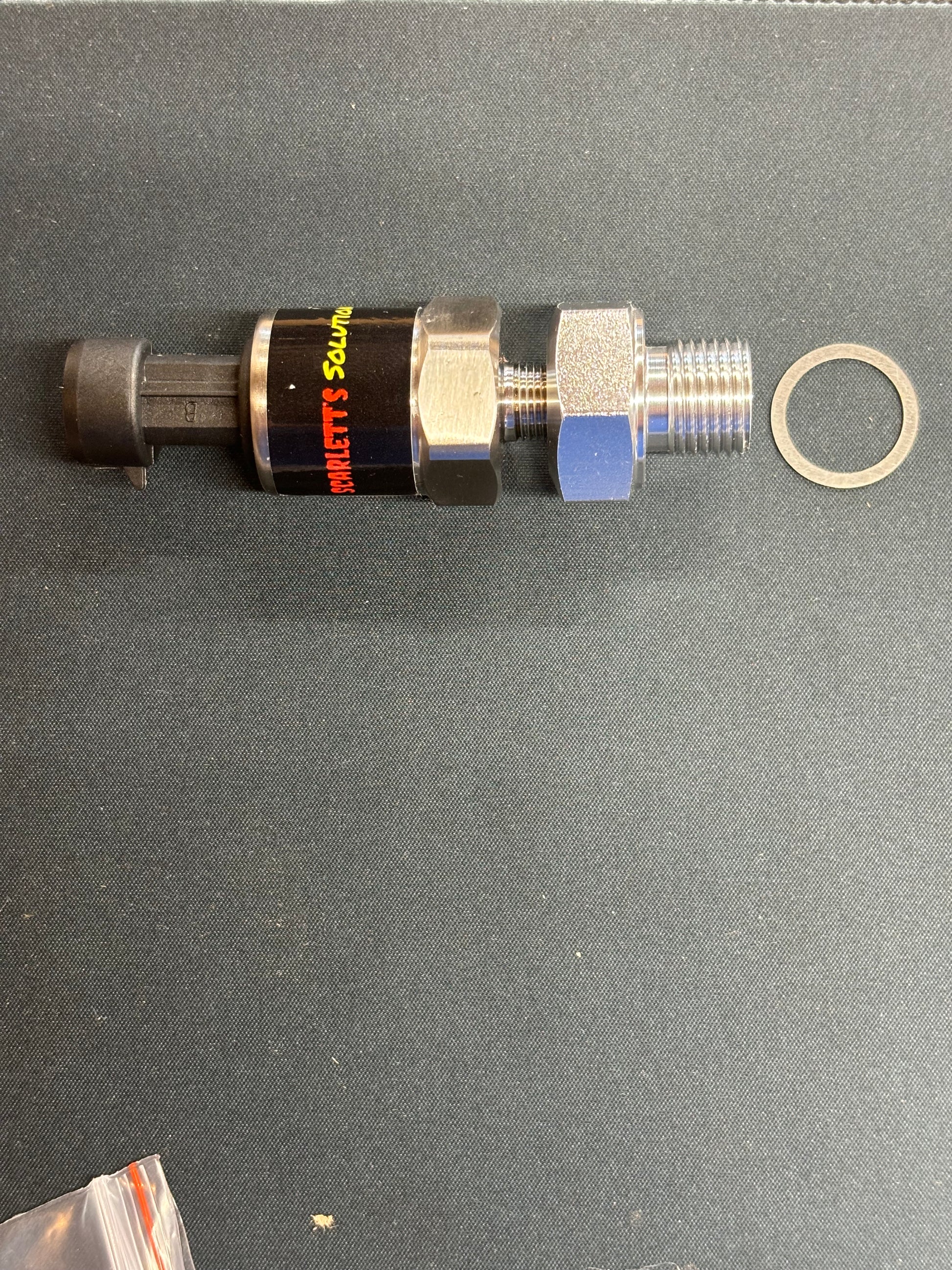 LS oil pressure adapter showing M16x1.5 to 1/8 NPT connection with gasket.